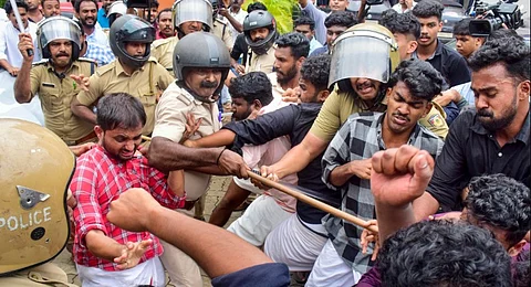 Police personnel lathicharge after clashes broke out between members of the Students Federation of India (SFI ) and the United Democratic Students' Front (UDSF) at the Kannur University, Kerala, Wednesday, Aug. 6, 2025.