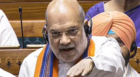 Union Home Minister Amit Shah speaks in the Lok Sabha amid protest by opposition members during the Monsoon session of Parliament, in New Delhi, Wednesday, Aug. 20, 2025.