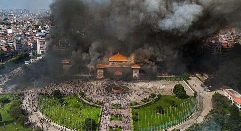 An aerial view of smoke rising from the Federal Parliament of Nepal premises after it was set on fire by protestors during massive anti-government protests, in Kathmandu, Nepal, Tuesday, Sept. 9, 2025.