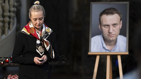 Says lab reports show her husband was poisoned