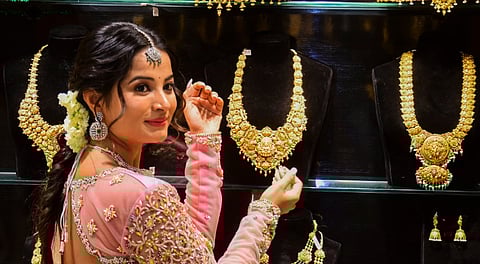Kannada Actress Anusha Rai poses with gold jewellery on the occasion of Akshaya Tritiya, in Bengaluru, Wednesday, April 30, 2025.