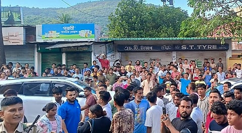 People throng outside the residence of Siddhartha Sharma, manager of music icon late Zubeen Garg, in Guwahati, Thursday, Sept. 25, 2025.