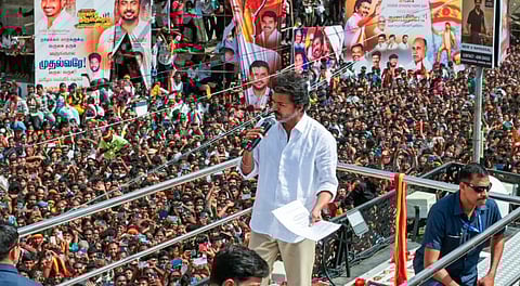 amilaga Vettri Kazhagam (TVK) chief and actor Vijay greets supporters during a rally, in Namakkal, Tamil Nadu, Saturday, Sept. 27, 2025.