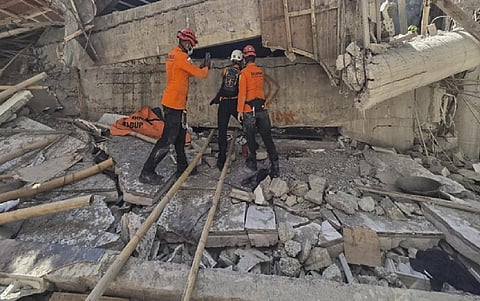 Indonesian rescuers search for missing students after school collapse kills 37