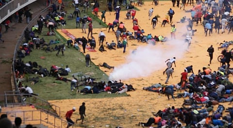 Kenyan police fire tear gas at mourners during former Prime Minister Odinga's public viewing in Nairobi.