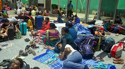 Passengers stranded at the Bhubaneswar railway station in the wake of Cyclone Montha, Tuesday, Oct. 28, 2025.