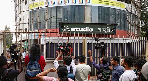 Media representaives at the site where 19 persons including 17 children were rescued from a studio in Powai area while the man who had held them hostage succumbed to bullet injuries sustained during the operation, in Mumbai, Thursday, Oct. 30, 2025.
