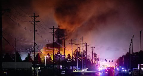 Plumes of smoke rise from the area of a UPS cargo plane crash at Louisville Muhammad Ali International Airport, on Tuesday, Nov. 4, 2025, in Louisville, Kentucky.