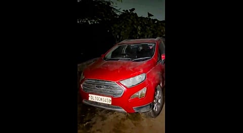 A red Ford EcoSport car, suspected to be linked to the Delhi Red Fort blast case, after being seized from Khandawali, in Faridabad district, Haryana on Nov. 12, 2025.