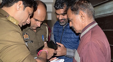 Police question the landlord and review tenancy documents at the residence of Dr. Arif Mir, a Kashmir-origin cardiologist, for suspected links with a Delhi blast accused, in Kanpur, Uttar Pradesh, Thursday, Nov. 13, 2025.