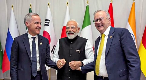 Prime Minister Narendra Modi with Australian Prime Minister Anthony Albanese and Canadian Prime Minister Mark Carney on the sidelines of the G20 Summit, in Johannesburg, South Africa. on Nov. 22, 2025.