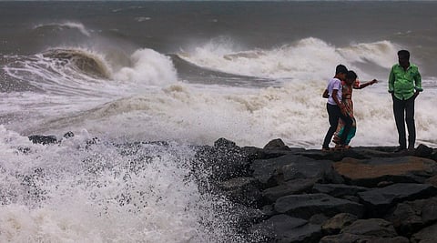High waves lash the Kasimedu shoreline amid rough sea conditions in the wake of the Cyclone Ditwah, in Chennai, Sunday, Nov. 30, 2025.