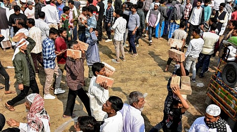 People carry bricks in view of former TMC MLA Humayun Kabir's plan to lay the foundation stone for a mosque, modelled on Ayodhya's Babri Masjid, at Rejinagar in West Bengal's Murshidabad district, escalating political temperatures in the state, Saturday, Dec. 6, 2025.