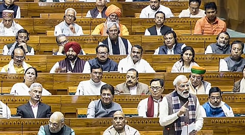 Prime Minister Narendra Modi speaks in the Lok Sabha during a discussion on the 150th anniversary of the national song 'Vande Mataram', at the Winter session of Parliament, in New Delhi, Monday, Dec. 8, 2025.