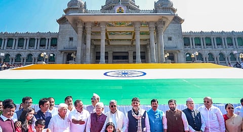 Karnataka Chief Minister Siddaramaiah and Deputy Chief Minister D.K. Shivakumar during the unveiling of the world's second largest khadi tricolour flag on the western steps of Suvarna Vidhana Soudha, in Belagavi on Dec. 9, 2025.