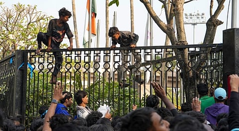 Agitated fans try to enter a hotel where Argentine footballer Lionel Messi is staying, after chaos erupted at an event as part of his 'G.O.A.T. India Tour 2025', in Kolkata, Saturday, Dec. 13, 2025.