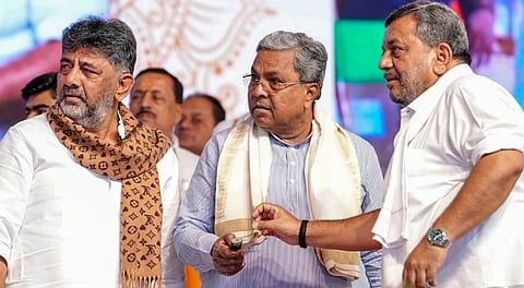 Karnataka Chief Minister Siddaramaiah, Deputy Chief Minister DK Shivakumar and others during an event on Dec. 26, 2025, in Davangere, Karnataka.