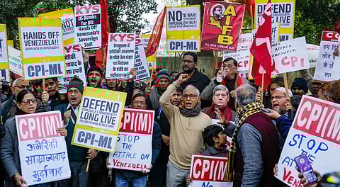 Members of the Communist Party of India (Marxist) and other organisations hold placards during a protest against US military strikes in Venezuela at Jantar Mantar, in New Delhi, Sunday, Jan. 4, 2026.