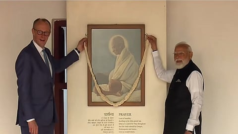 PM Modi, German Chancellor Merz pay tributes to Mahatma Gandhi