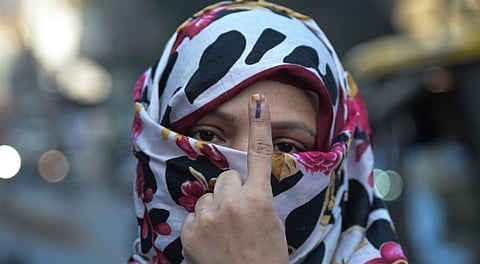 A woman shows her ink marked finger after casting vote at a polling station during the Nagpur Municipal Corporation (NMC) elections, in Nagpur, Maharashtra, Thursday, Jan. 15, 2026.