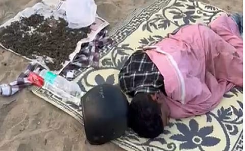 The man sleeping with the ganja lying beside him