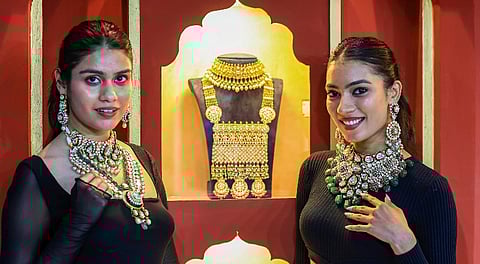 Models pose at a jewellery show in Jaipur.