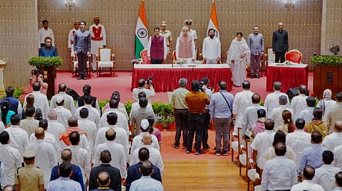 Maharashtra Chief Minister Devendra Fadnavis, Governor Acharya Devvrat, Deputy CM Eknath Shinde and Rajya Sabha MP Sunetra Pawar, wife of late NCP chief Ajit Pawar, with others during the latter's swearing-in ceremony as the state's first woman Deputy Chief Minister at Lok Bhavan, in Mumbai.