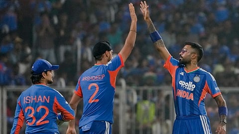 India's Arshdeep Singh, centre, celebrates with Hardik Pandya, right, and Ishan Kishan after taking the wicket of New Zealand's captain Mitchell Santner during the fifth and final T201 cricket match between India and New Zealand, at the Greenfield International Stadium, in Thiruvananthapuram, Kerala, Saturday, Jan. 31, 2026.