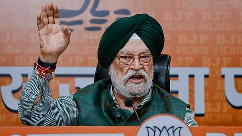 Union Minister Hardeep Singh Puri addresses a press conference at BJP headquarters, in New Delhi, Wednesday, Feb. 11,