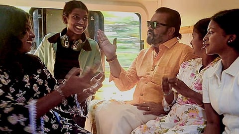 Union Minister of State Suresh Gopi, centre, travels on the Amrit Bharat Express from Aluva.