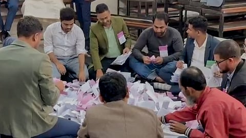 Polling officials during counting of votes after the parliamentary elections, in Dhaka, Bangladesh, Thursday, Feb. 12, 2026.