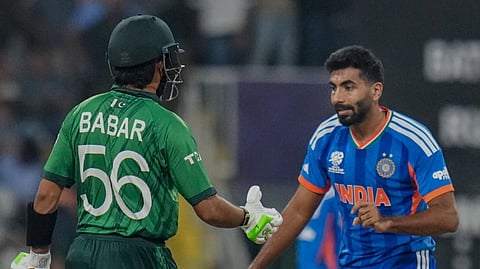 India's Jasprit Bumrah, right, and Pakistan's Babar Azam during an ICC Men's T20 World Cup 2026 cricket match between India and Pakistan, at R Premadasa Stadium, in Colombo, Sri Lanka, Sunday, Feb. 15, 2026.