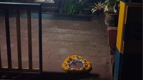 A wreath was placed outside the home of writer V.S. Anilkumar in Kannur.