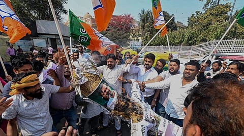 Bharatiya Janata Yuva Morcha (BJYM) activists burn an effigy of Leader of Opposition in the Lok Sabha Rahul Gandhi to protest Youth Congress workers' shirtless disruption at the India AI Impact Summit 2026 in New Delhi, in Patna, Saturday, Feb. 21, 2026.