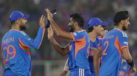 India's Jasprit Bumrah celebrates with teammates after taking the wicket of South Africa's Ryan Rickelton during an ICC Men's T20 World Cup 2026 cricket match between India and South Africa, at the Narendra Modi Stadium, in Ahmedabad, Sunday, Feb. 22, 2026.