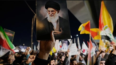 Government supporters raise slogans as they gather in mourning over Iranian Supreme Leader Ayatollah Ali Khamenei, in Tehran, Iran, March 1, 2026.