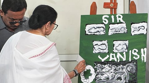 West Bengal Chief Minister Mamata Banerjee paints on a canvas, during a five-day sit-in dharna against alleged arbitrary deletions from the post-SIR electoral rolls, in Kolkata, Tuesday, March 10, 2026.