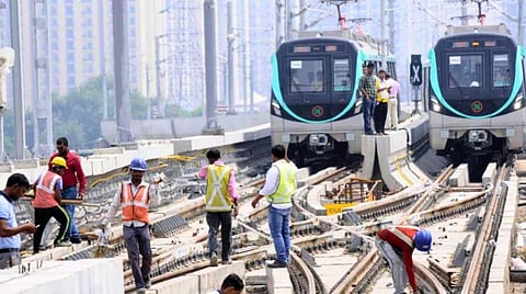 Delhi Metro employees inspecting fault in signalling cable network.