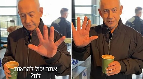 Israeli PM Benjamin Netanyahu held up both his hands, one by one, toward the camera to show that he had ten fingers.