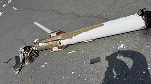 A piece of fallen wartime ordnance debris lies on a street in the UAE.