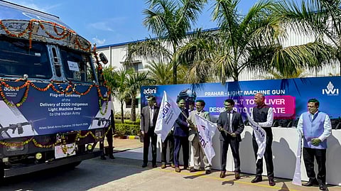 A Anbarasu, DG Acquisition, Ministry of Defence, Ashish Rajvanshi, CEO of Adani Defence and Aerospace, and other senior officials flag off trucks carrying 'Prahar' light machine guns (LMGs) after the first batch was handed over to the Indian Army by Adani Defence and Aerospace, at its Small Arms Complex, in Gwalior, Madhya Pradesh, Saturday, March 28, 2026.