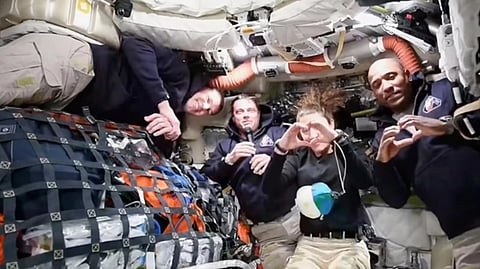 Artemis II crew Commander Reid Wiseman, second from left, thanking the families of the crew while speaking with NASA Mission Control in a video conference while en route to the moon, Thursday, April 2, 2026.