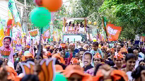Union Home Minister Amit Shah during a roadshow ahead of the Kerala Assembly election, in Kozhikode, Kerala.