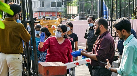 Forensic team inspects after an SUV driven by a masked man forced its way through one of the boundary gates of the Delhi Assembly premises, in New Delhi, Monday, April 6, 2026.