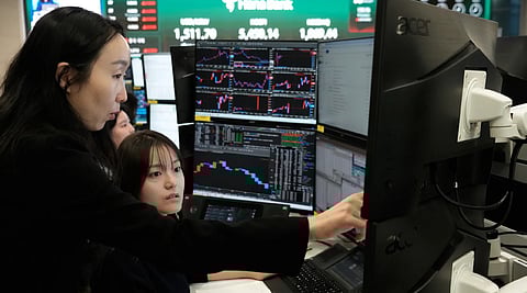 Asian shares mostly gain while oil prices keep rising