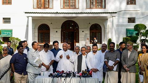 Congress President Mallikarjun Kharge addresses a press conference after a meeting between INDIA bloc leaders, in New Delhi, Wednesday, April 15, 2026.