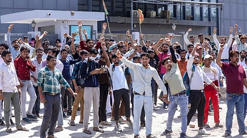 Factory workers during a protest demanding a hike in wages, in Noida, Gautam Buddh Nagar district, Uttar Pradesh, Monday, April 13, 2026.