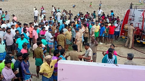 Police, rescue pesonnel and locals gather after a blast at a firecracker factory, at Kattanarpatti, in Virudhunagar district, Tamil Nadu, Sunday, April 19, 2026.
