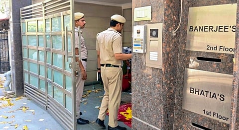 Police officials at the site after a woman, daughter of a senior IRS officer, was found murdered at her residence in southeast Delhi's Amar Colony area, Wednesday, April 22, 2026.