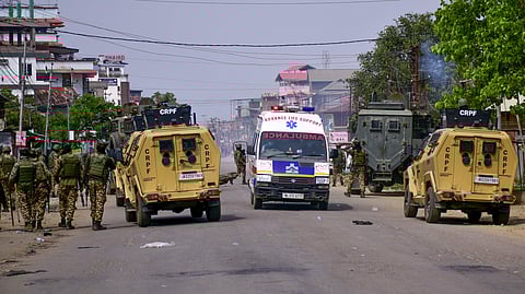 Security personnel arrive during a clash after thousands demanding permanent peace were stopped from marching towards the Chief Minister's residence, in Imphal, Manipur, Saturday, April 25, 2026.